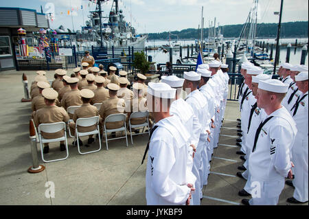 170818-N-EH218-051 BREMERTON, Wash. (Aug. 18, 2017) – Master of Ceremonies, Senior Chief Machinist’s Mate (Nuclear) Buck Browning, assigned to the Nimitz-class aircraft carrier USS Nimitz (CVN 68), addresses chief petty officer (CPO) selectees during the CPO Legacy Academy graduation in front of museum ship USS Turner Joy. The selectees spent the week living, working, and training aboard the Vietnam War-era ship along with a group of CPO mentors who provided leadership and training on naval history as well as the heritage of the CPO community. (U.S. Navy photo by Mass Communication Specialist  Stock Photo