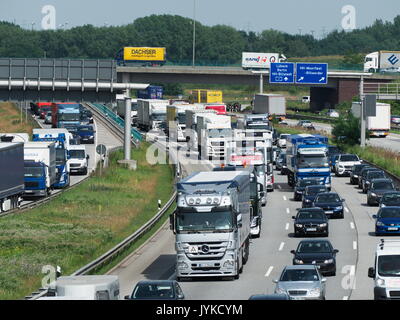 German Autobahn motorway expressway highway traffic Jam truck lorry container bottleneck congestion CO2 emissions Stock Photo