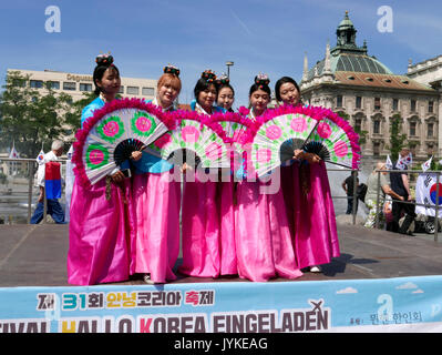 Germany Munich young ladies promoting Korean tourism at Karlsplatz Stock Photo