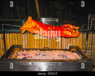 Roasted pig on the spit Stock Photo