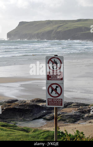 warning prohibitive signs on a Cornish beach no fires or barbeques, no dogs, no camping and danger unsafe cliffs walking surfing at the beaches Stock Photo