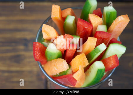 To view of colored vegetables sticks on wooden table Stock Photo