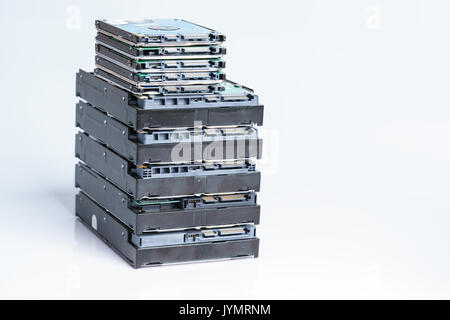 pile of old hard drives at white background Stock Photo