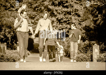Family of five walking on path dog outside B&W Black & White front full length MR  © Myrleen Pearson Stock Photo