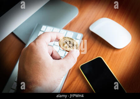 Man holds Bitcoin Stock Photo