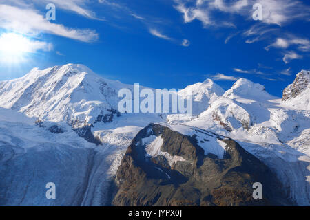 Swiss Alps with glaciers against blue sky, Zermatt area, Switzerland Stock Photo