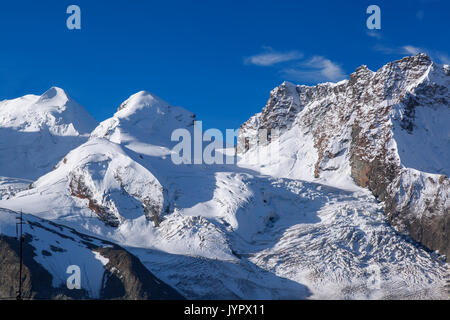 Swiss Alps with glaciers against blue sky, Zermatt area, Switzerland Stock Photo