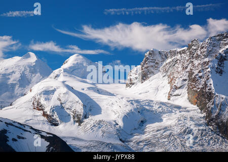 Swiss Alps with glaciers against blue sky, Zermatt area, Switzerland Stock Photo