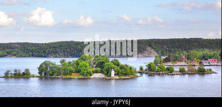 Scandinavian landscape with islands and small lighthouse, Sweden Stock Photo