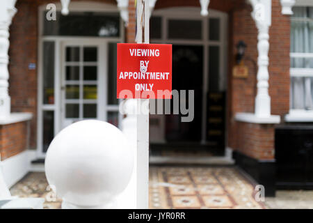 Sign outside Victorian terraced housing with sign 'Viewing By Appointment Only'. Stock Photo