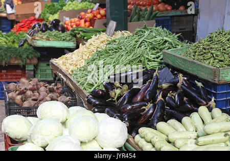Fresh organic vegetables pile on market stall