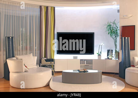 Modern living room interior with large TV Stock Photo