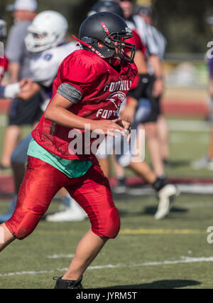 Football action with Shasta at Foothill High School in Palo Cedro, California. Stock Photo