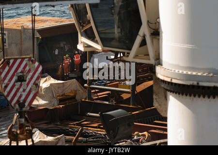 Workers on the deck of the Saipem S7000, working in the metal workshop fabricating industrial materials. credit: LEE RAMSDEN / ALAMY Stock Photo