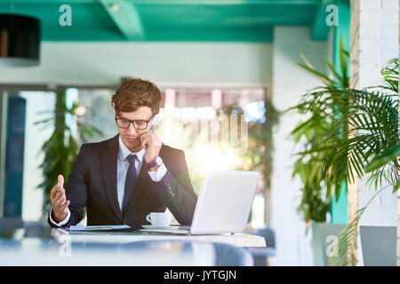 Handsome Manager Working in Office Stock Photo