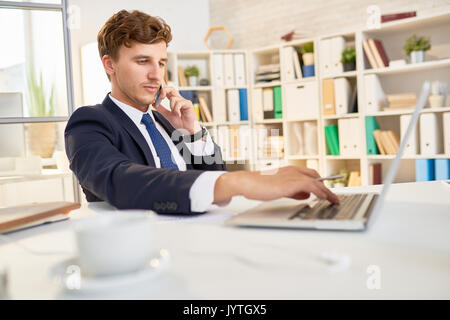 Confident Businessman Working in Office Stock Photo