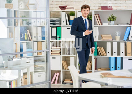 Handsome Businessman Posing in Office Stock Photo