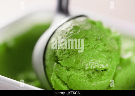 scooping green ice cream close up Stock Photo