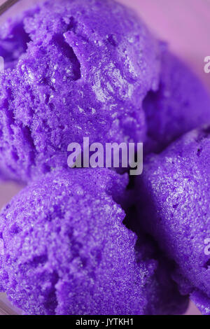 scooped balls of purple ice cream close up Stock Photo