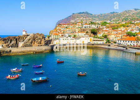 View of Camara de Lobos port with colourful fishing boats on sea, Madeira island Stock Photo
