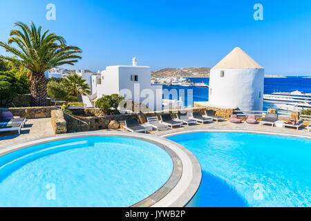 MYKONOS TOWN, GREECE - MAY 17, 2016: swimming pools of a luxury hotel in Mykonos town, Mykonos island, Greece. Stock Photo