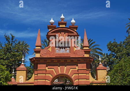 Spain: architectural details and view of the Gardens of Charles V of the Alcazar of Seville, royal palace outstanding example of mudejar architecture Stock Photo