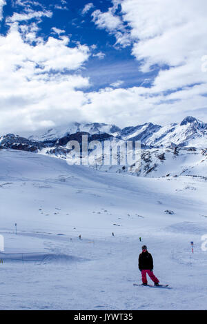 Person with snowboard in back country mountain Stock Photo