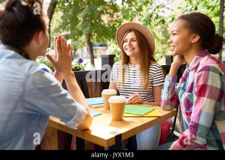 Group of Young People Studying in Cafe Stock Photo