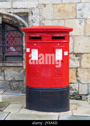 A traditional red double fronted Royal Mail post box with boxes labelled for “Stamped” and “Franked” mail York  England UK Stock Photo