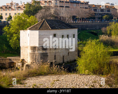 CORDOBA, SPAIN - MARCH 12, 2016:  Disused mill on the River Guadalquivir Stock Photo