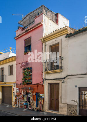 CORDOBA, SPAIN - MARCH 12, 2016:  Exterior view of pretty painted house and gift shop