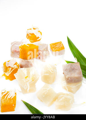 Sweet cassava cake banana dessert taro dessert and pumpkin dessert with young coconut sliced isolated on white background Stock Photo