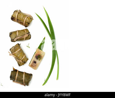 Thai dessert couple of Banana in Sticky Rice and Black Beans Wrapped in Banana leaves Stock Photo