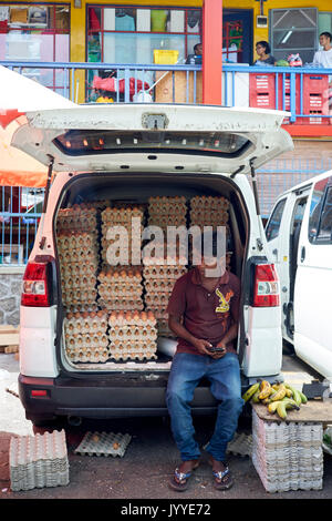 Trader sells eggs out of his van Stock Photo
