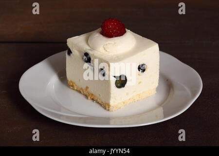 Frozen cheesecake with blueberry and raspberry Stock Photo