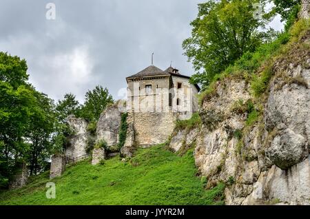 Old antique castle on a green hill. Beautiful castle in Ojcow, Poland. Stock Photo