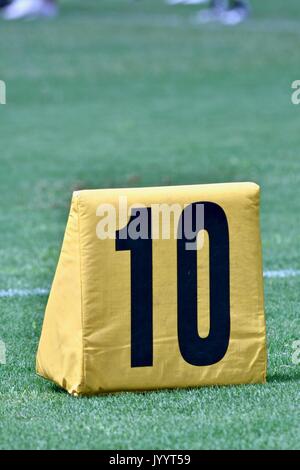 10 yard marker on American football field Stock Photo