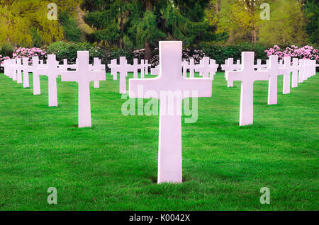 White marble headstones from an American memorial graveyard, displayed in a perfect symmetry, located in Hamm, Luxembourg city. Stock Photo