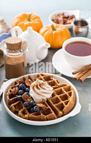 Pumpkin waffles with whipped cream and cinnamon Stock Photo