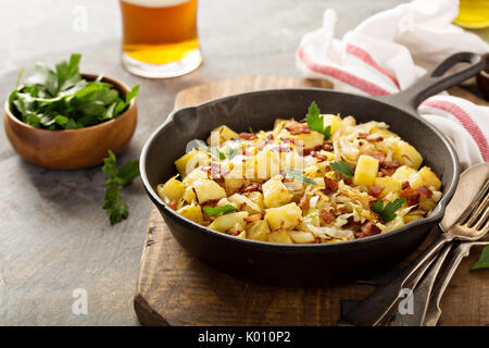 Fall side dish with fried cabbage, potatoes and bacon Stock Photo