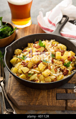 Fall side dish with fried cabbage, potatoes and bacon Stock Photo