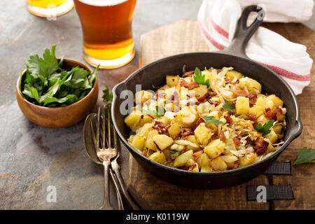 Fall side dish with fried cabbage, potatoes and bacon Stock Photo