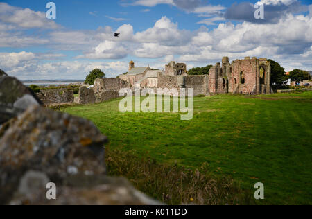 Lindisfarne Priory and parish church on the Holy Island of Lindisfarne of England's north east coast Stock Photo