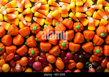 Candy corn and pumpkin Halloween background Stock Photo