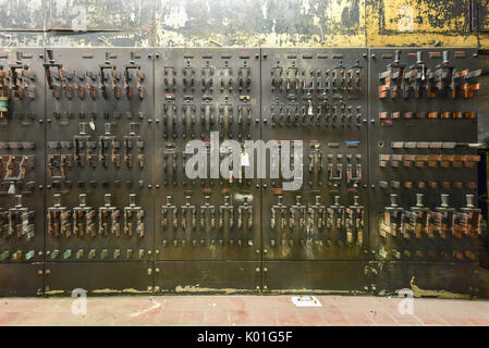 Vintage electrical breakers, fuses, handles and meters. Stock Photo