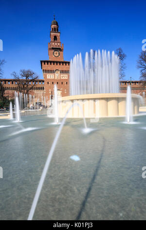 The fountain frames the ancient Sforza Castle Milan Lombardy Italy Europe Stock Photo