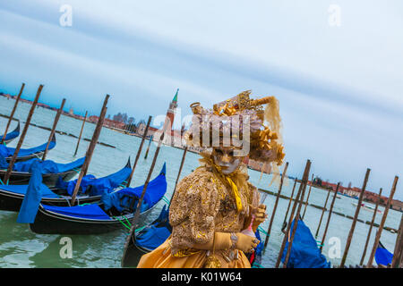 Colorful mask and costume of Carnival of Venice famous festival worldwide Veneto Italy Europe Stock Photo