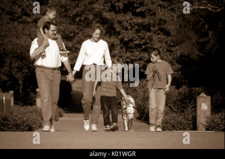 Family of five walking dog outside B&W black and white vintage nature outside vacation holiday front full length © Myrleen Pearson Stock Photo
