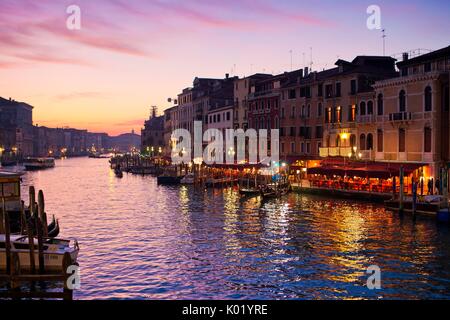Sunset on restaurants along the Grand Canal in Venice. Veneto Italy Europe Stock Photo