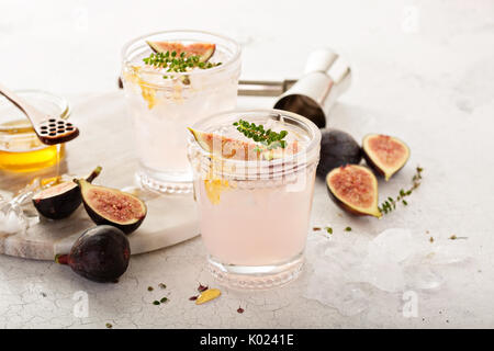 Pink fig cocktail with honey and thyme Stock Photo